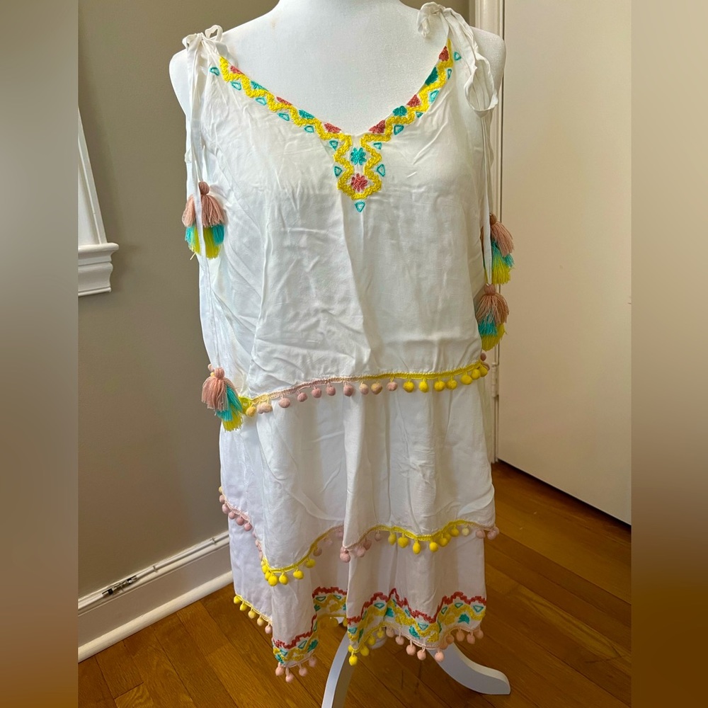 White cover up lines with embroidery and Pom poms